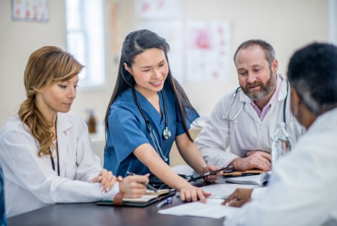 Doctors discussing a policy